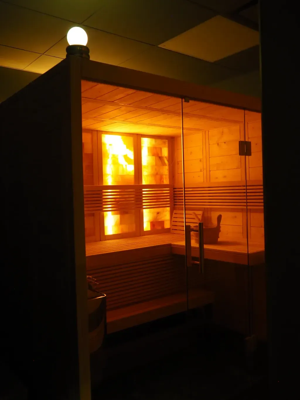 The private suite at Sauna Culture Charlotte — Finnish salt sauna lit for an exclusive booking