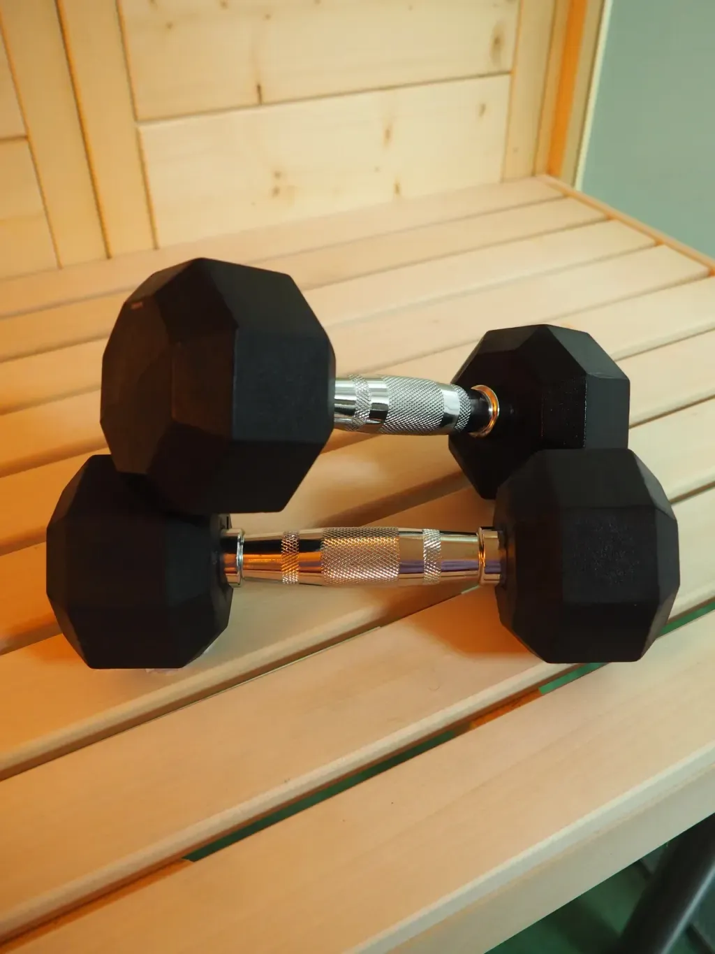 Strength-trained athlete using the Finnish sauna for post-workout recovery at Sauna Culture Charlotte