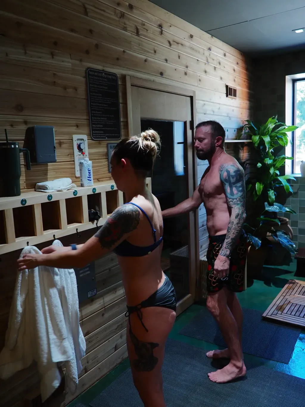 Couple walking into the sauna room at Sauna Culture Charlotte