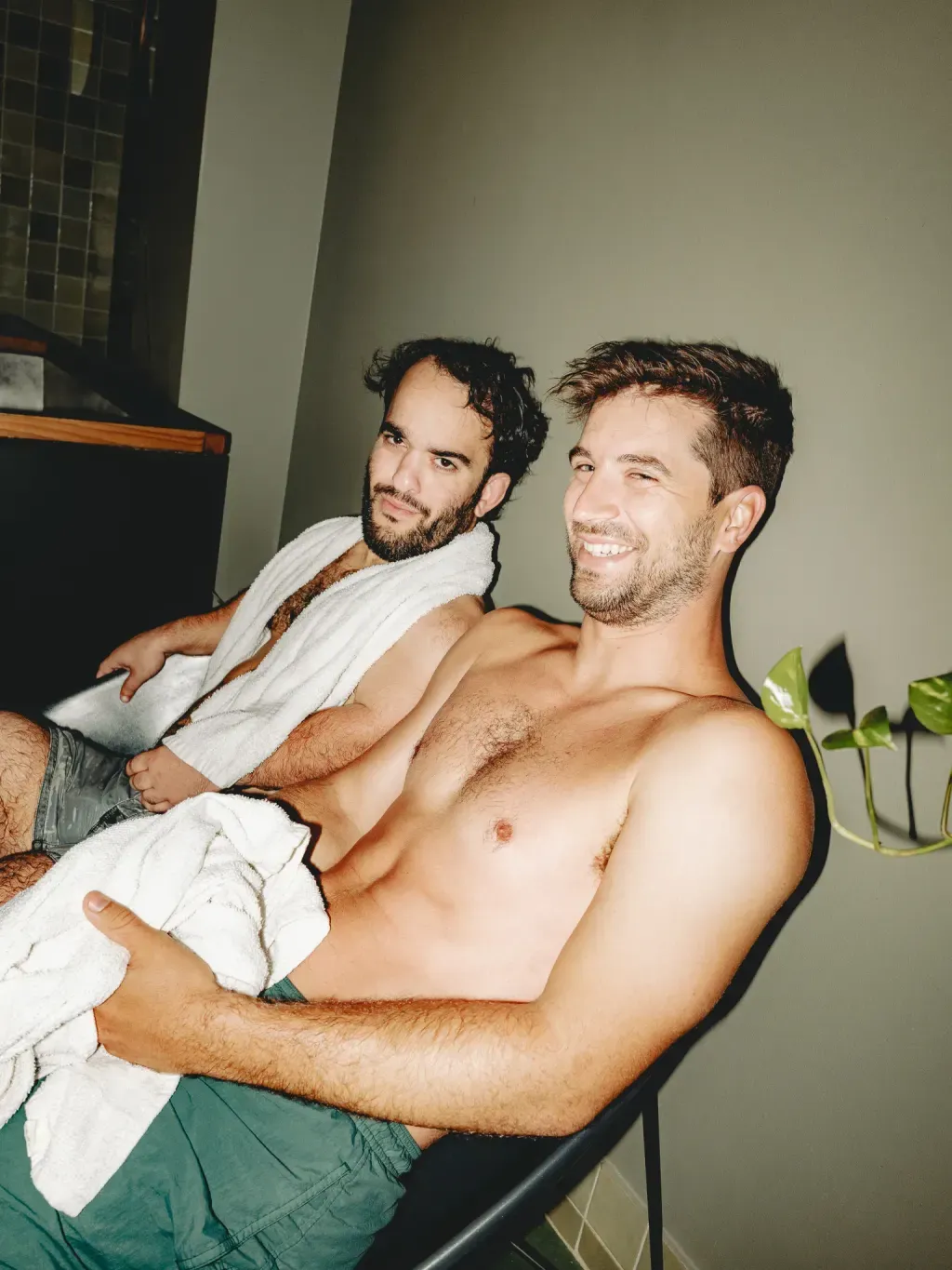 Two guests on lounge chairs between rounds at Sauna Culture in Cotswold, Charlotte