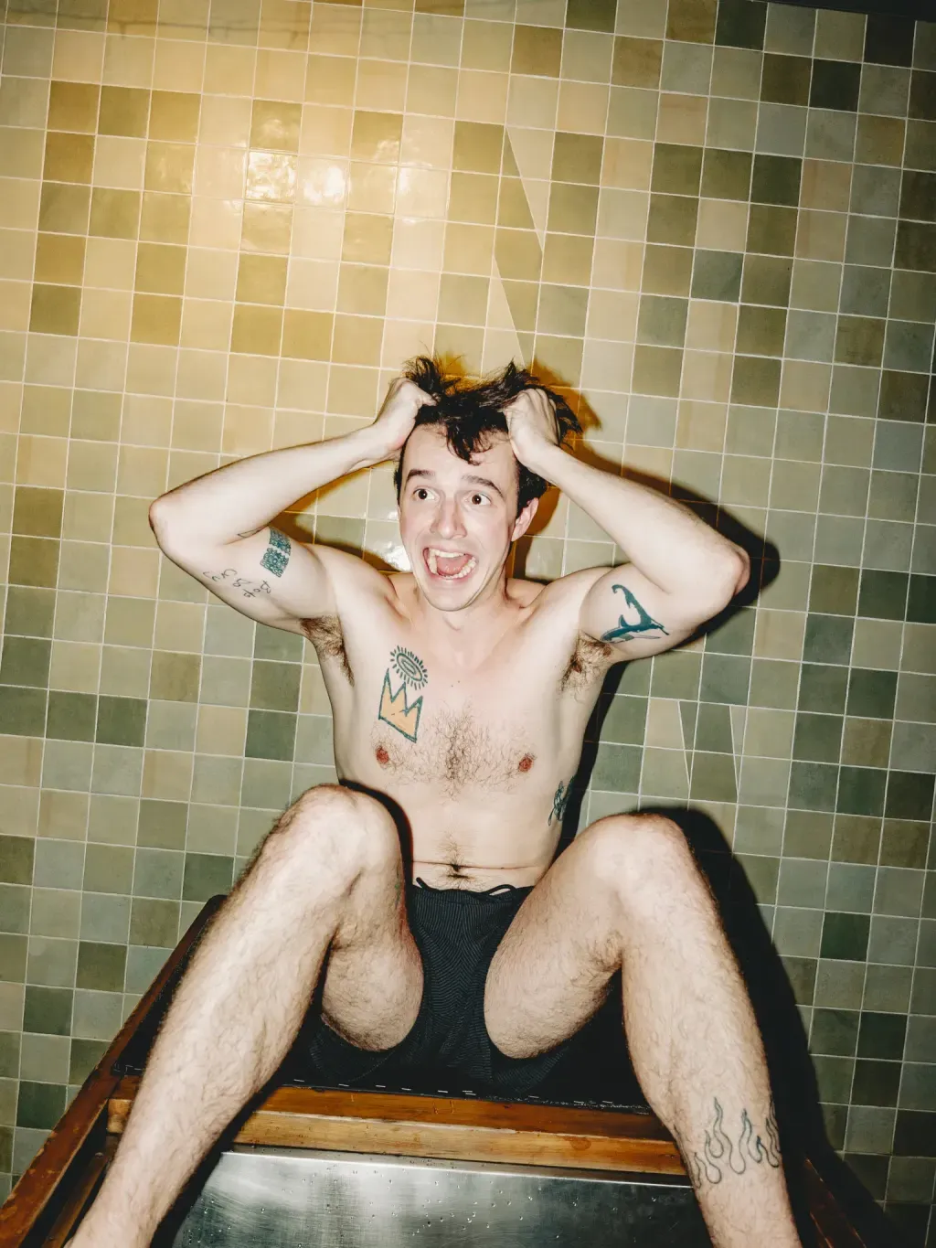 Guest reacting to the cold in an individual plunge at Sauna Culture Charlotte